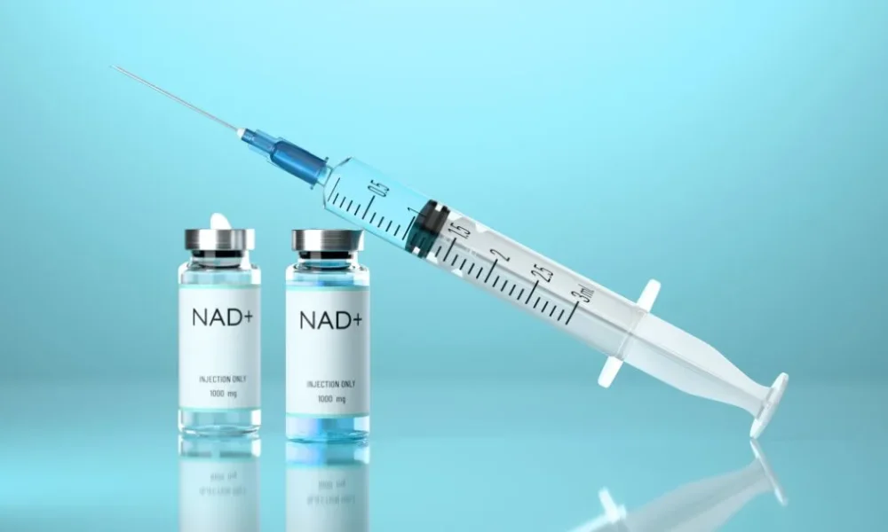 Syringe and vials labeled NAD+ Injection 1000 mg, representing the advanced NAD+ therapy and delivery method.