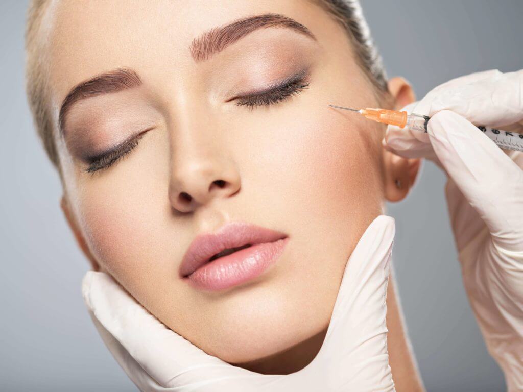 Beautiful Closed Eye Woman Receiving Botox Injection | Essence Med Spa in Grand Island & Hastings, NE