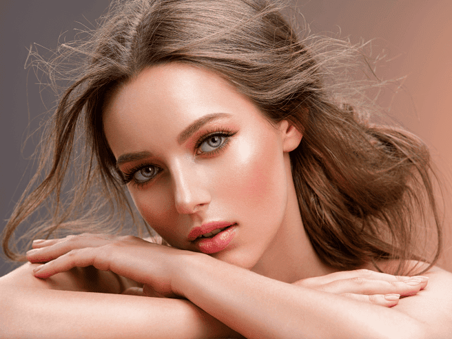 Clear Skin Young Girl Posing with Messy Hair | Essence Med Spa in Grand Island & Hastings, NE